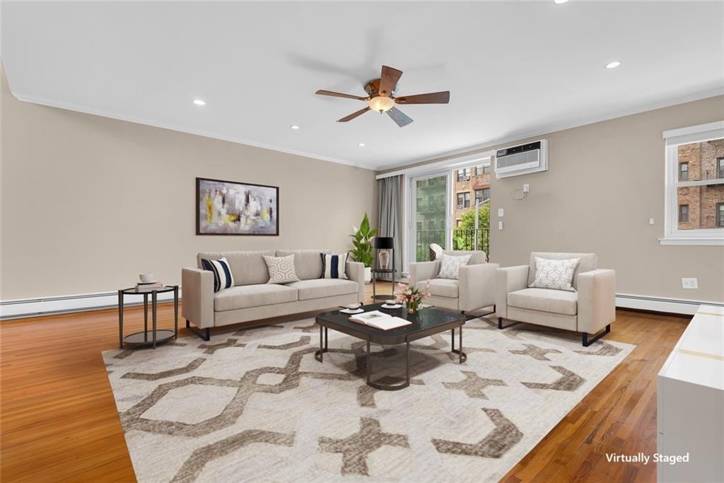 129 Bay Ridge Parkway, Unit 3 Brooklyn, NY 11209 - Photo 1 of 13 a living room with furniture and a large window