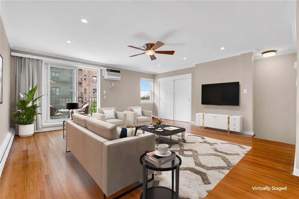 129 Bay Ridge Parkway, Unit 3 Brooklyn, NY 11209 - Photo 3 of 13 a living room with furniture and a flat screen tv