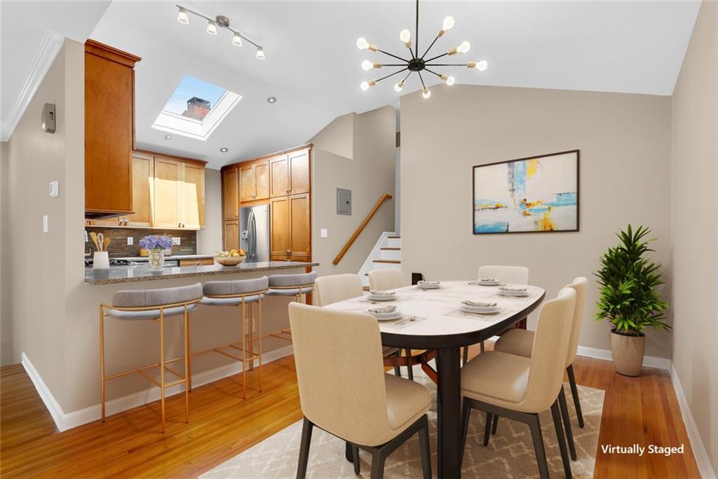 129 Bay Ridge Parkway, Unit 3 Brooklyn, NY 11209 - Photo 5 of 13 a view of a dining room with furniture window and wooden floor