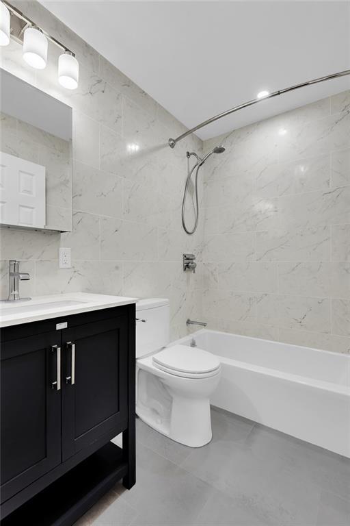 129 Bay Ridge Parkway, Unit 3 Brooklyn, NY 11209 - Photo 7 of 13 a bathroom with a sink a toilet and shower