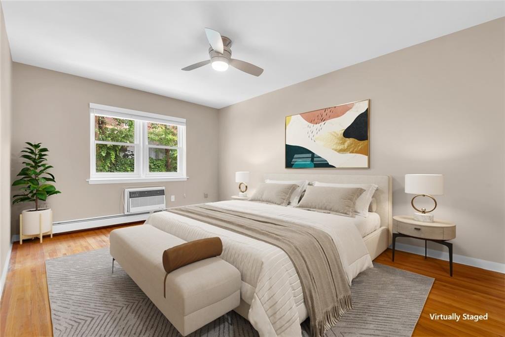 129 Bay Ridge Parkway, Unit 3 Brooklyn, NY 11209 - Photo 8 of 13 a bedroom with a bed and wooden floor