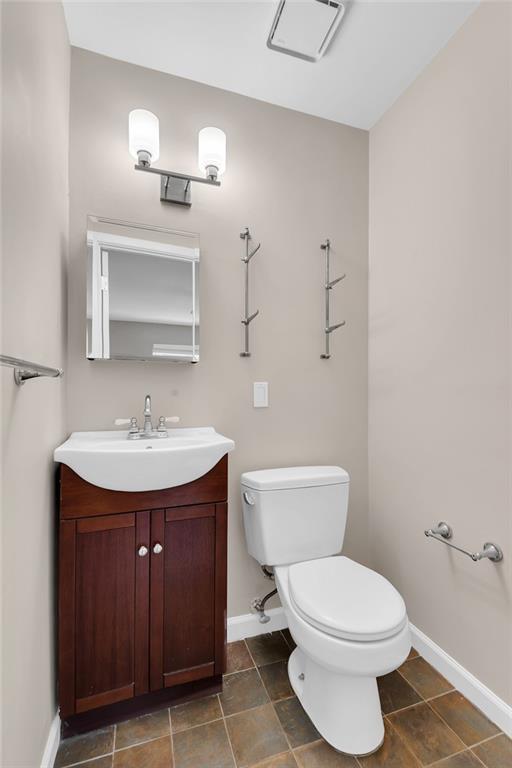 129 Bay Ridge Parkway, Unit 3 Brooklyn, NY 11209 - Photo 9 of 13 a bathroom with a toilet sink and mirror