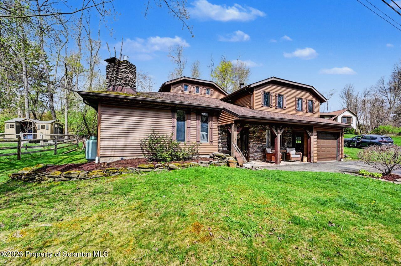 719 Scott Road Clarks Summit, PA 18411 - Photo 49 of 51 a view of a house with a yard and sitting area