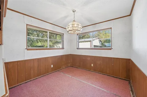 a view of an empty room with windows