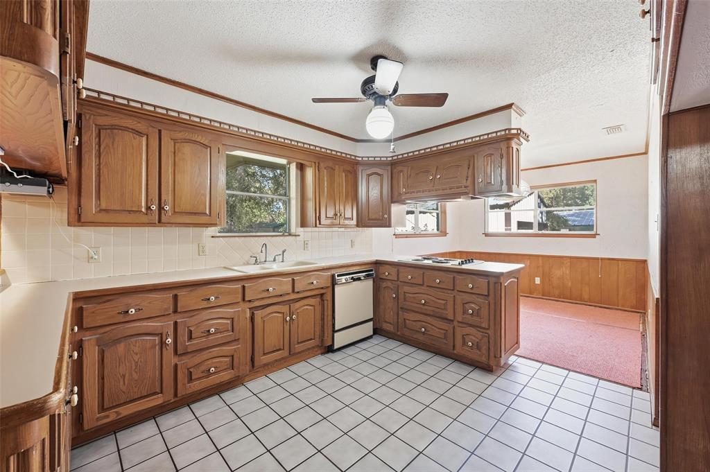 1508 Red Oak Circle Azle, TX 76020 - Photo 10 of 27 Kitchen has small dining area that could be used to enlarge the kitchen space