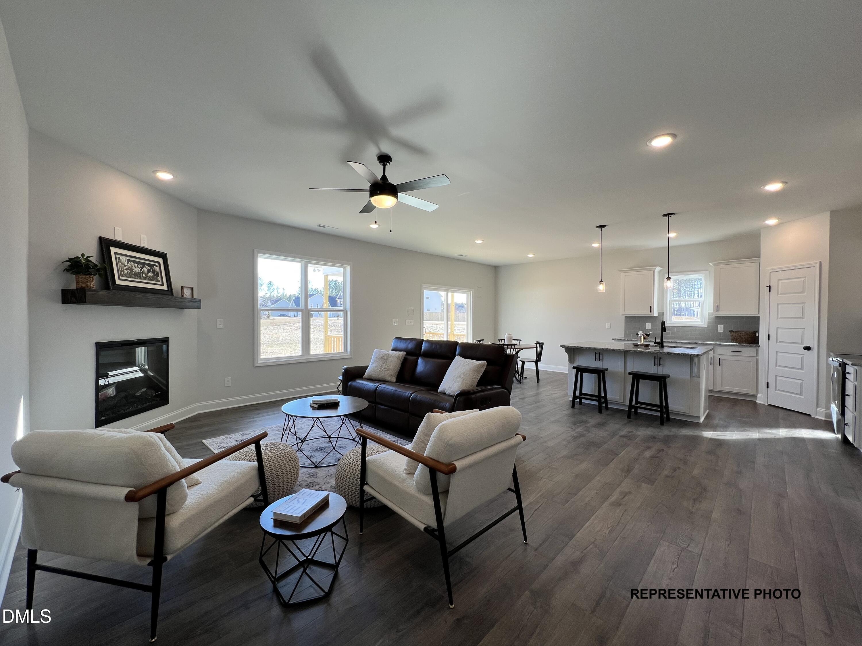 75 Cardovia Way Wendell, NC 27591 - Photo 5 of 17 a living room with furniture and a fireplace