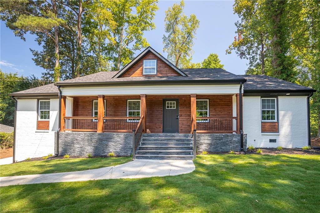 610 Glenforest Road Atlanta, GA 30328 - Photo 1 of 44 front view of a house with a yard