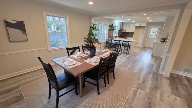 610 Glenforest Road Atlanta, GA 30328 - Photo 12 of 44 a view of a dining room with furniture and wooden floor