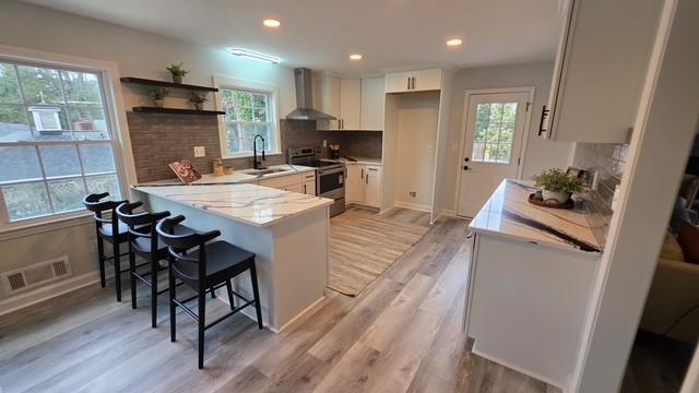 610 Glenforest Road Atlanta, GA 30328 - Photo 14 of 44 a kitchen with granite countertop a stove a sink a dining table and chairs