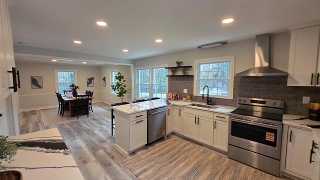 610 Glenforest Road Atlanta, GA 30328 - Photo 15 of 44 a kitchen with a sink a stove and cabinets