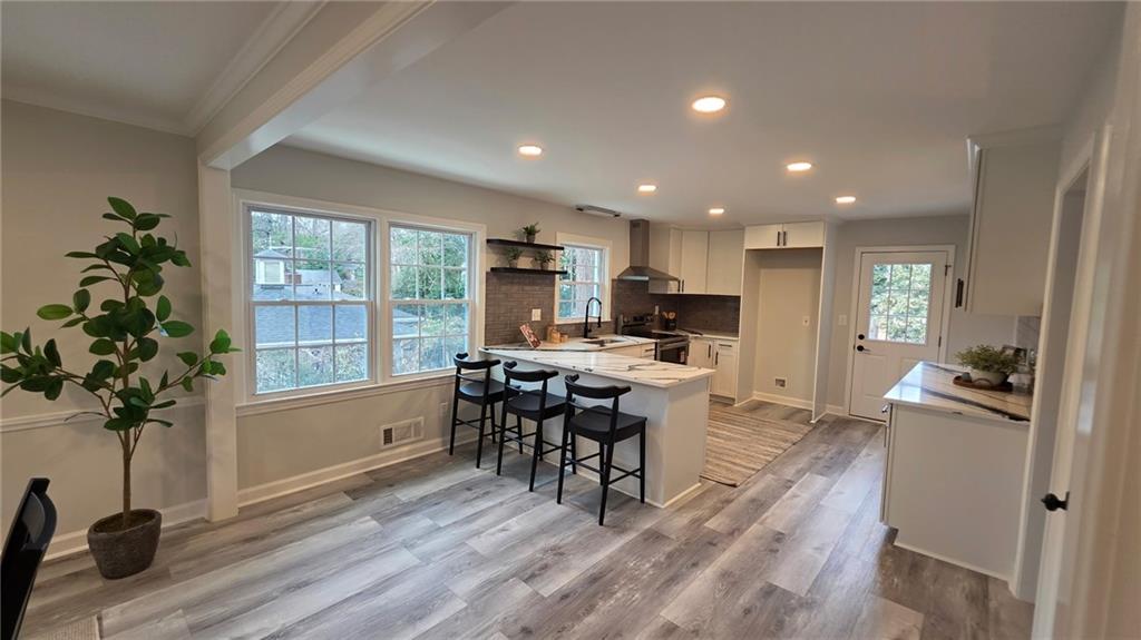 610 Glenforest Road Atlanta, GA 30328 - Photo 16 of 44 a view of a dining room with furniture window and wooden floor