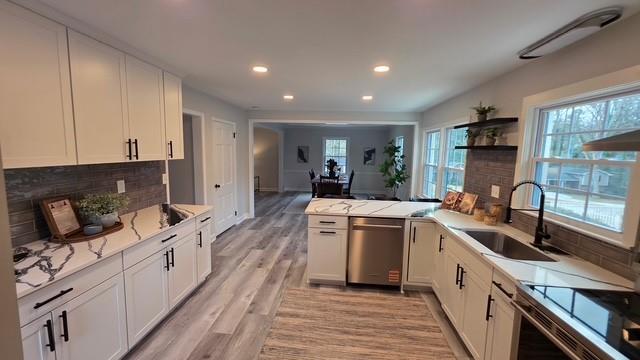 610 Glenforest Road Atlanta, GA 30328 - Photo 17 of 44 a kitchen with a sink stove and refrigerator