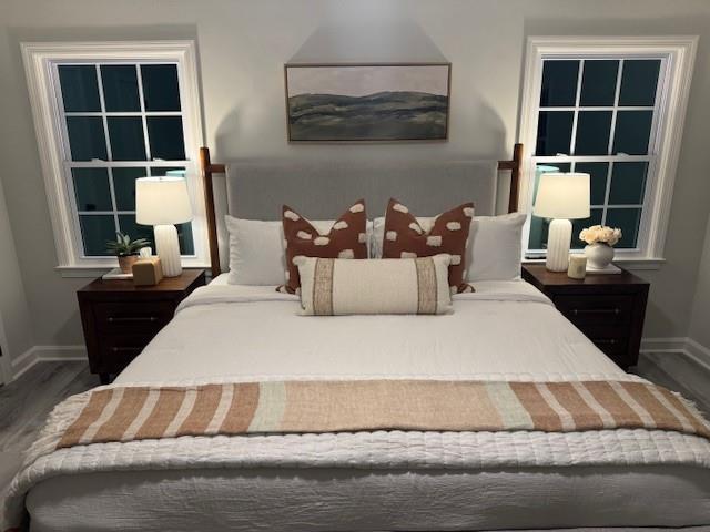 610 Glenforest Road Atlanta, GA 30328 - Photo 18 of 44 a bed sitting in a bedroom next to a window