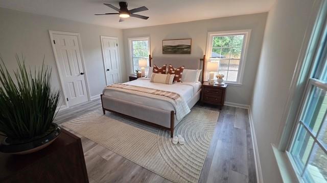 610 Glenforest Road Atlanta, GA 30328 - Photo 19 of 44 a bedroom with a bed and a large window