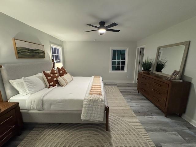 610 Glenforest Road Atlanta, GA 30328 - Photo 20 of 44 a bedroom with a large bed and a flat tv screen