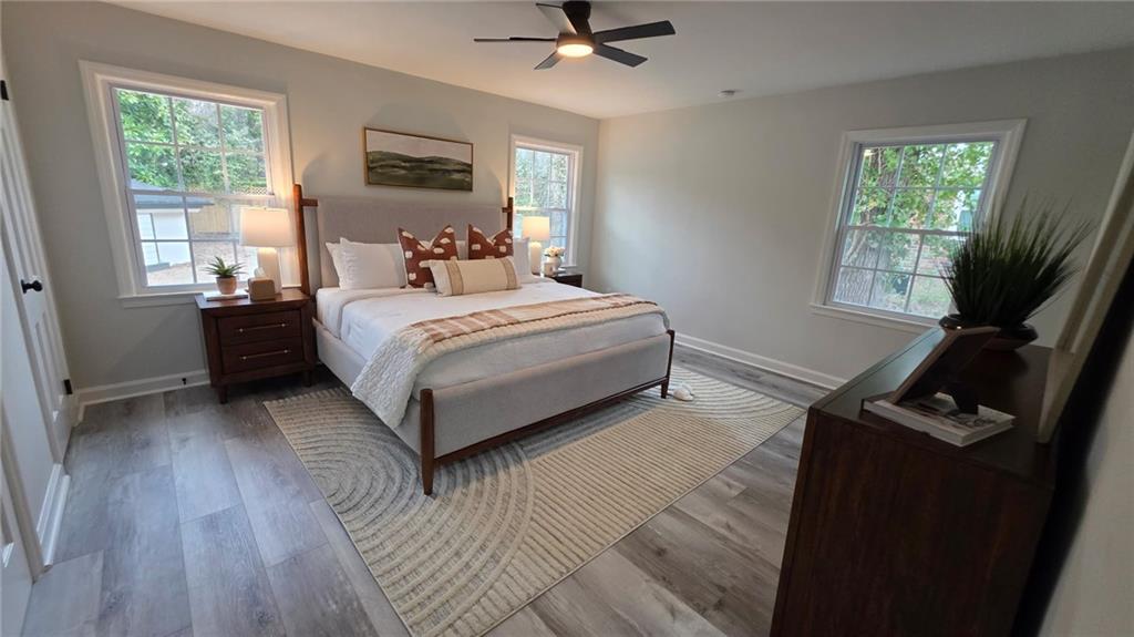 610 Glenforest Road Atlanta, GA 30328 - Photo 21 of 44 a bedroom with a bed and a window