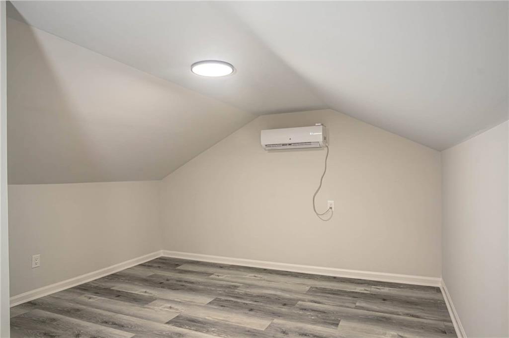 610 Glenforest Road Atlanta, GA 30328 - Photo 32 of 44 a view of a room with wooden floor and fan