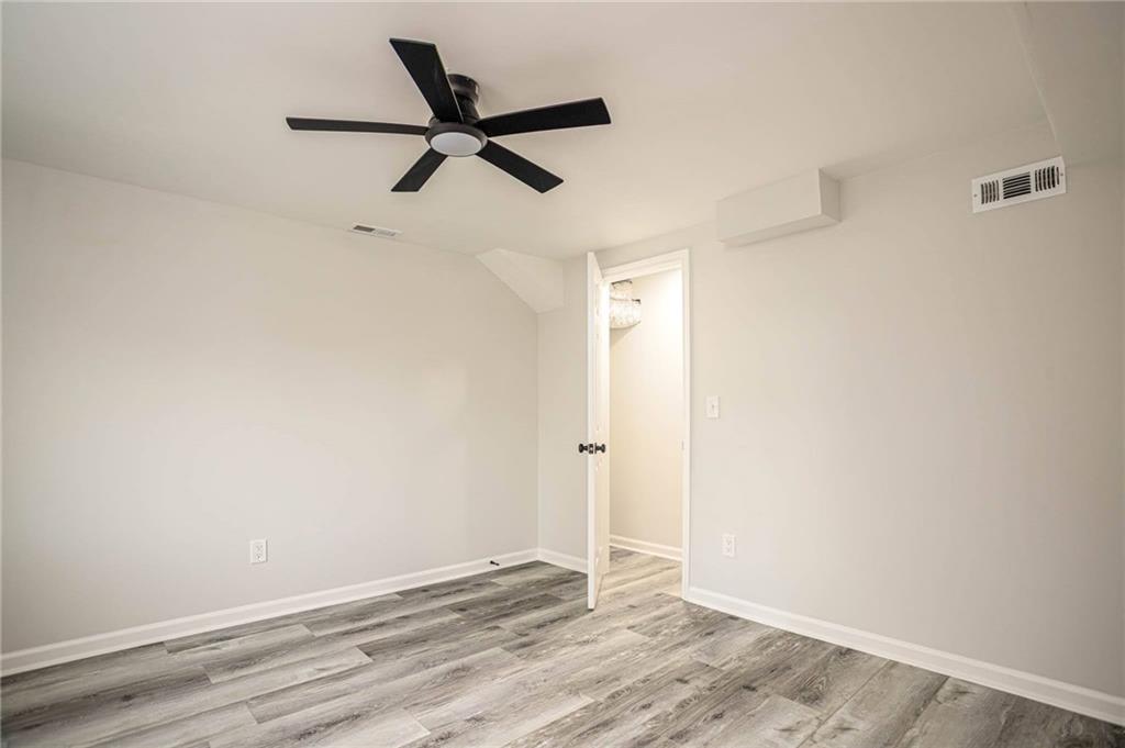 610 Glenforest Road Atlanta, GA 30328 - Photo 35 of 44 a view of a room with wooden floor and closet