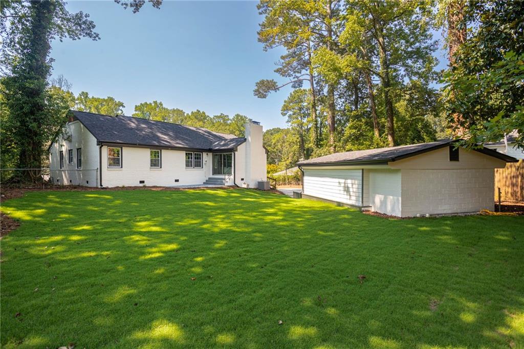 610 Glenforest Road Atlanta, GA 30328 - Photo 38 of 44 a front view of house with yard and green space