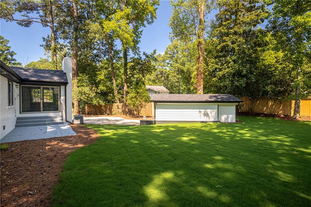 610 Glenforest Road Atlanta, GA 30328 - Photo 40 of 44 a view of a house with a yard