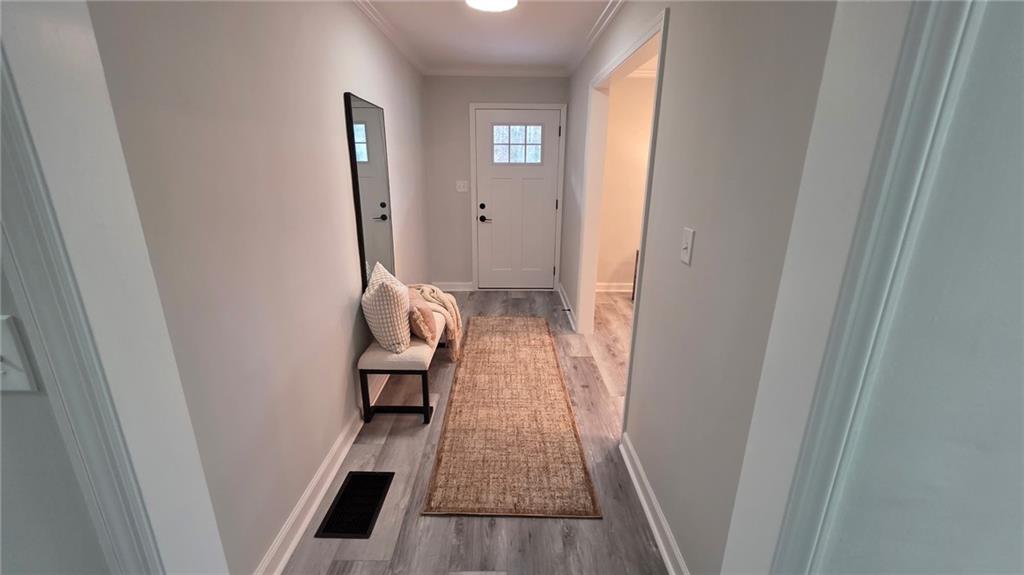 610 Glenforest Road Atlanta, GA 30328 - Photo 7 of 44 a view of hallway with wooden floor