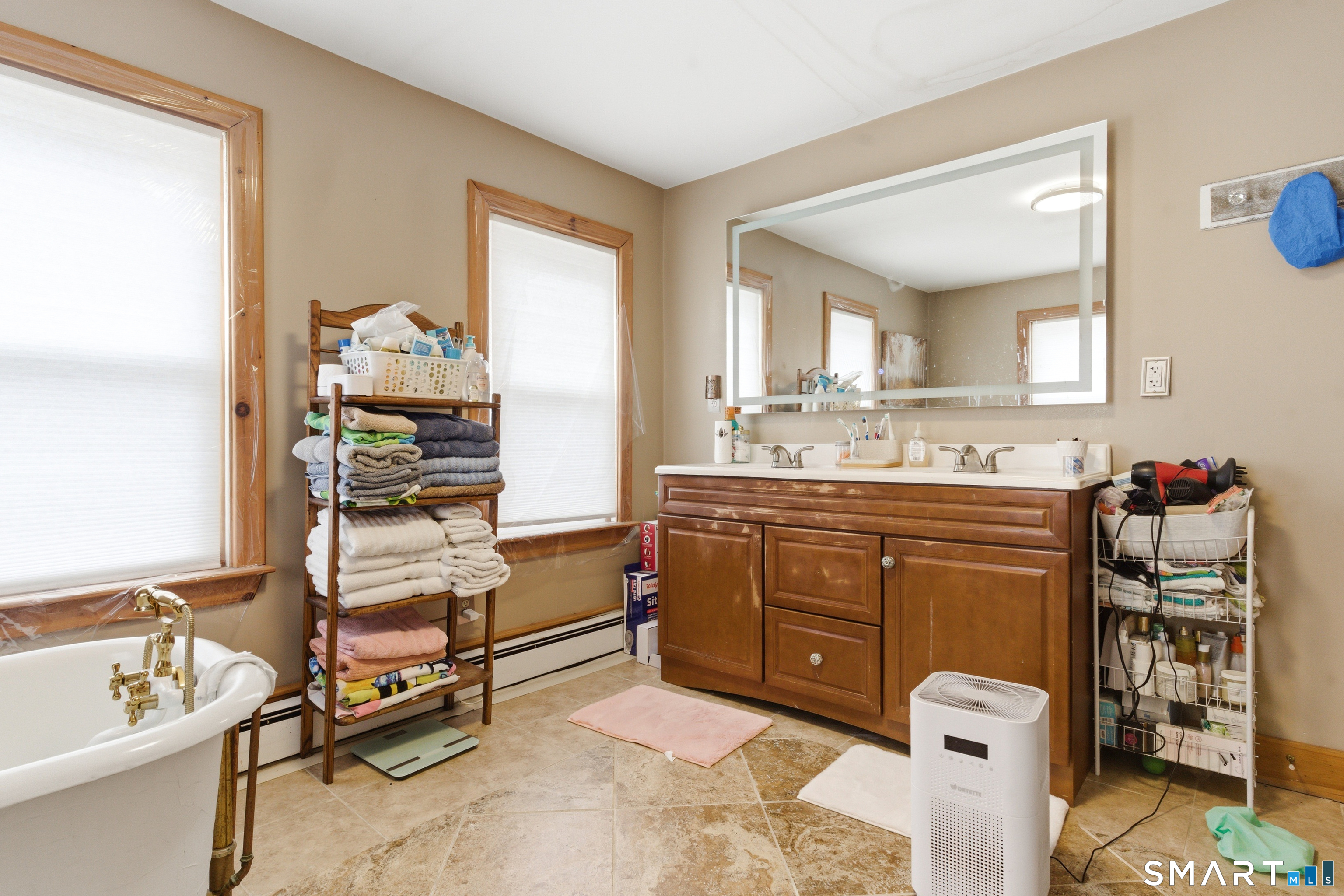 36 Church Street Killingly, CT 06241 - Photo 15 of 39 a spacious bathroom with a granite countertop sink and a mirror