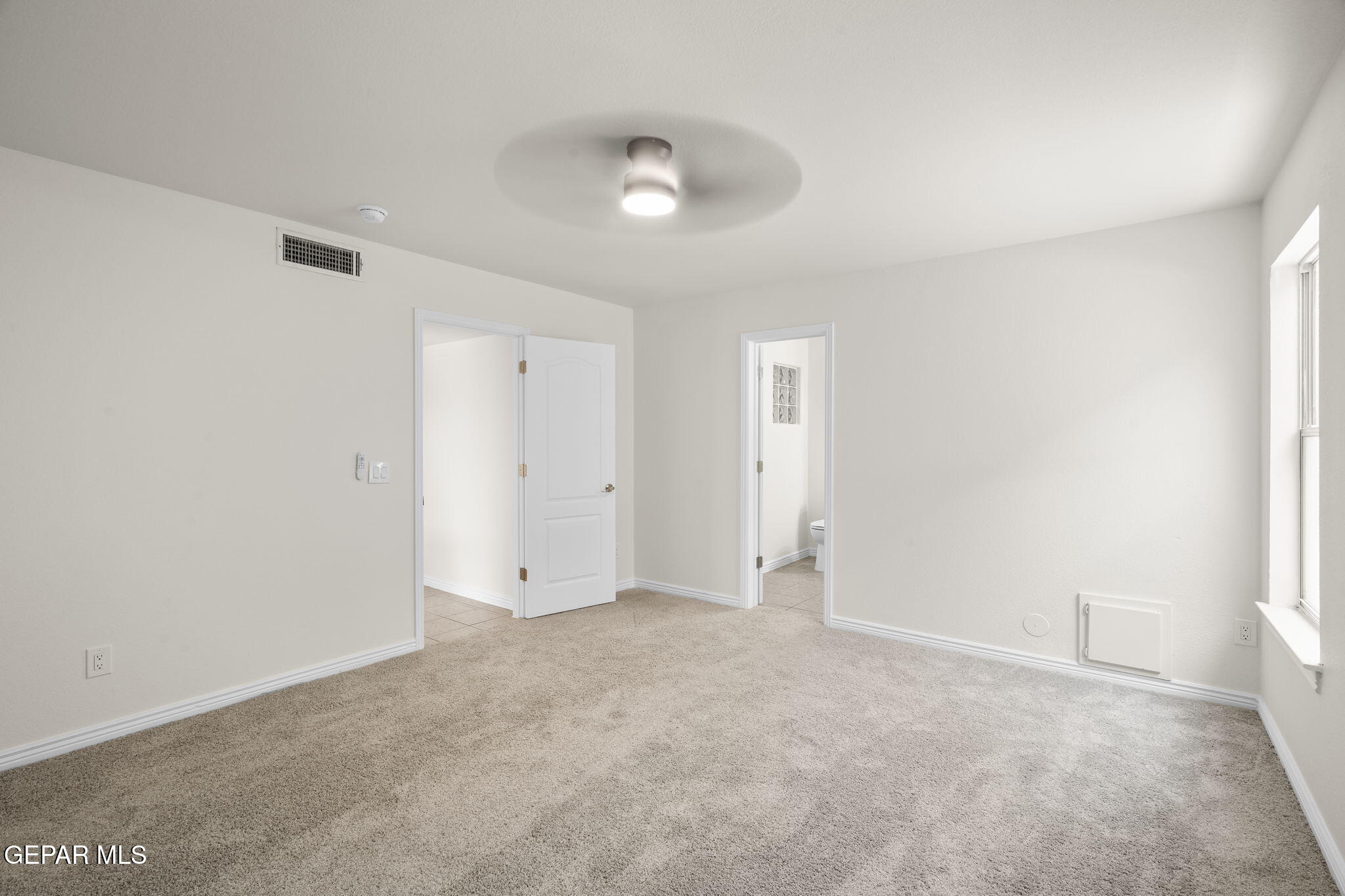 3657 Sammy Reece PIace El Paso, TX 79938 - Photo 24 of 56 an empty room with an entryway and fan