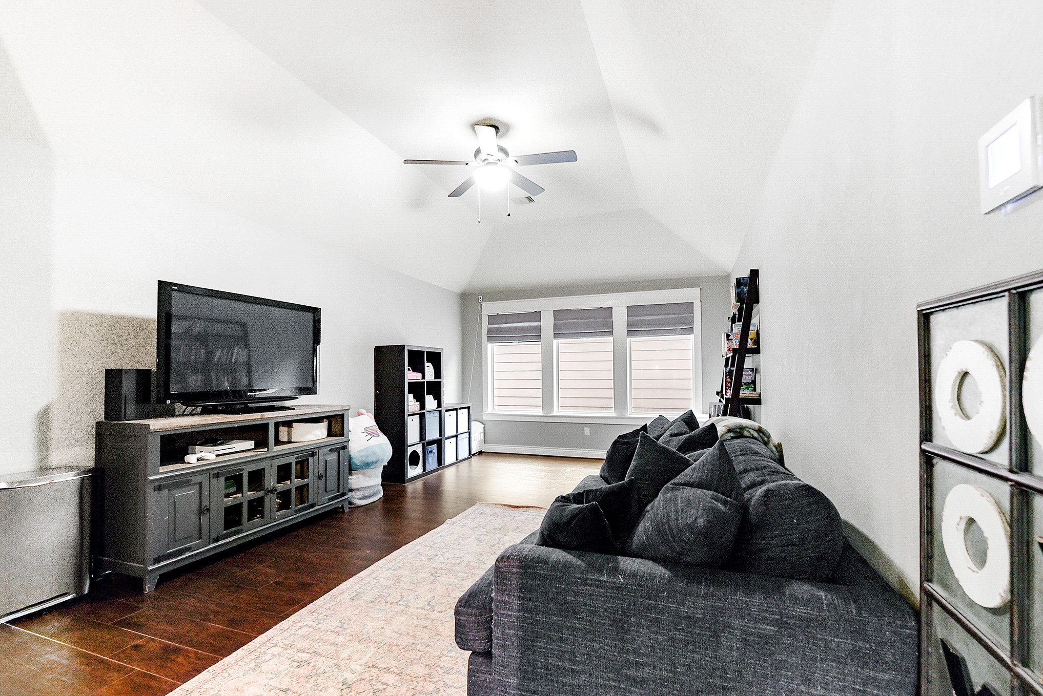 2939 Bobby Jones Road Katy, TX 77494 - Photo 33 of 50 a living room with furniture and a flat screen tv