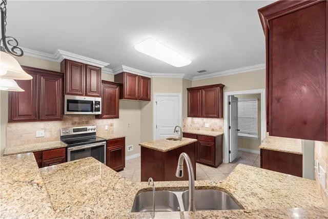 a kitchen with granite countertop lots of counter top space