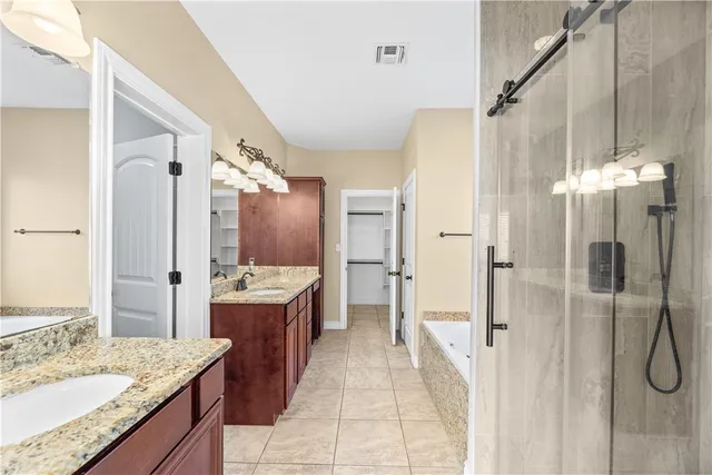 a bathroom with a glass shower door