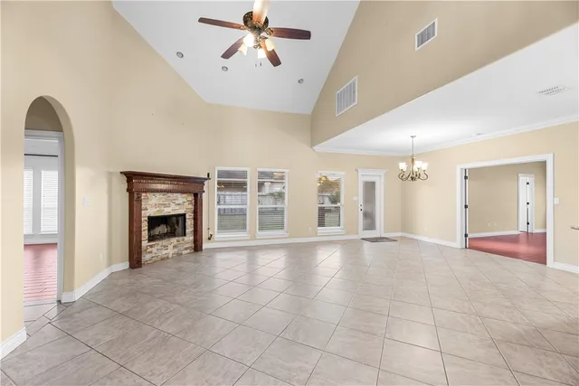 a view of a hallway with chandelier