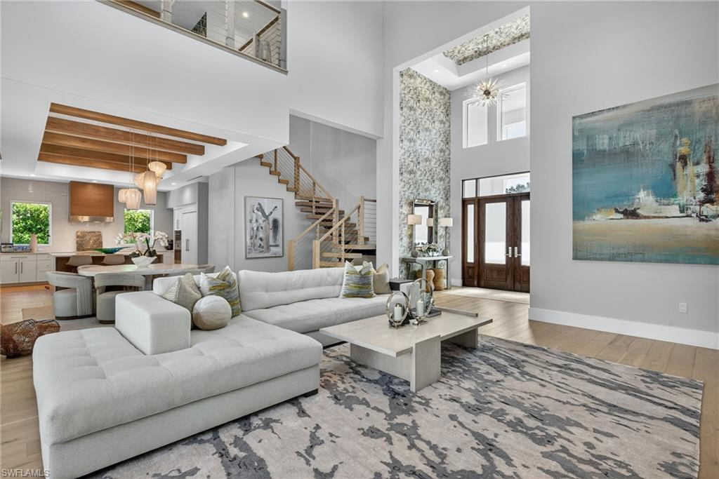 405 7th Avenue North Naples, FL 34102 - Photo 2 of 50 a living room with furniture and wooden floor