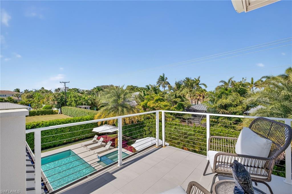 405 7th Avenue North Naples, FL 34102 - Photo 28 of 50 a view of a chairs and table in the balcony