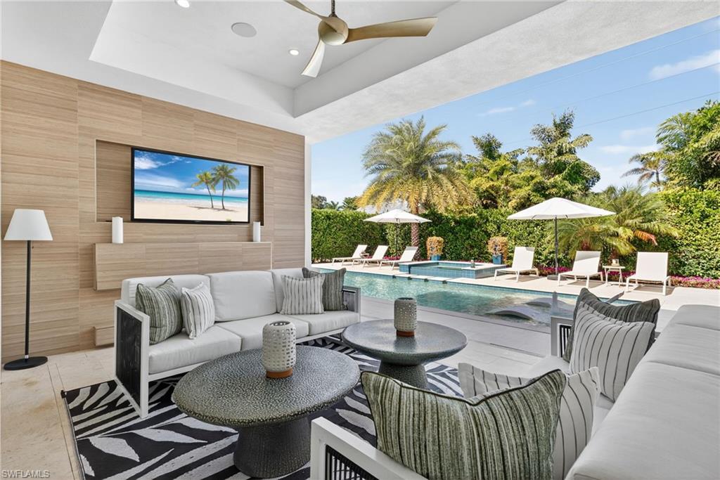 405 7th Avenue North Naples, FL 34102 - Photo 3 of 50 a living room with furniture and a potted plant
