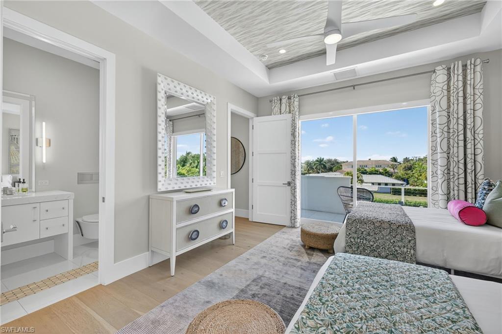 405 7th Avenue North Naples, FL 34102 - Photo 34 of 50 a bedroom with a bed and a window