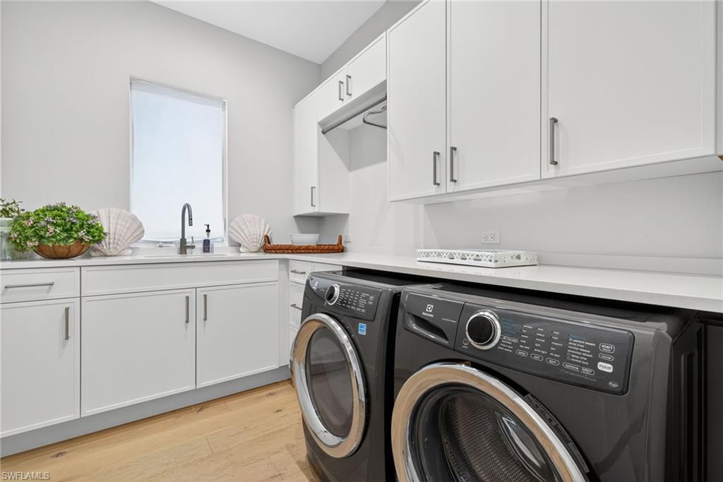 405 7th Avenue North Naples, FL 34102 - Photo 40 of 50 a utility room with sink dryer and washer