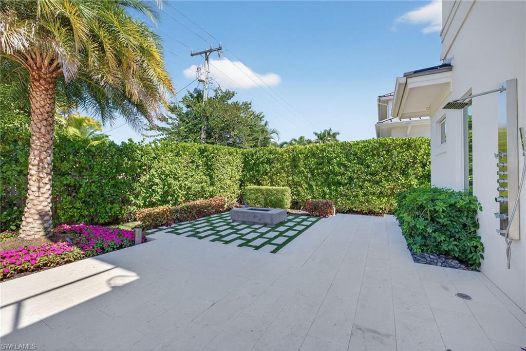 405 7th Avenue North Naples, FL 34102 - Photo 45 of 50 a view of a street with potted plants