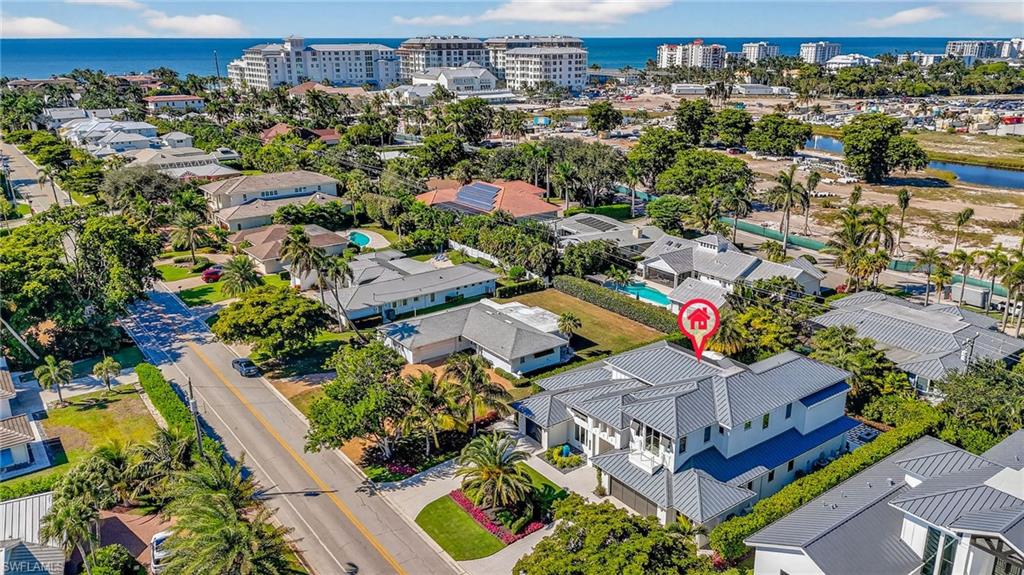 405 7th Avenue North Naples, FL 34102 - Photo 48 of 50 an aerial view of a house with a garden