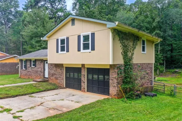 a backyard of a house with lots of green space