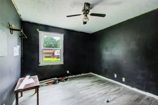 a view of a dining room with furniture and a window