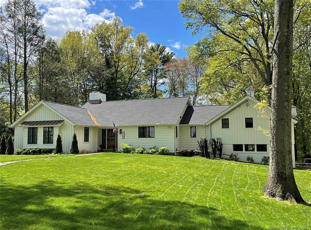 338 Old Oaks Road Fairfield, CT 06825 - Photo 1 of 1 a front view of a house with a yard