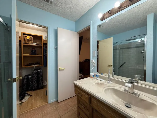 a view of empty room with a fireplace and window