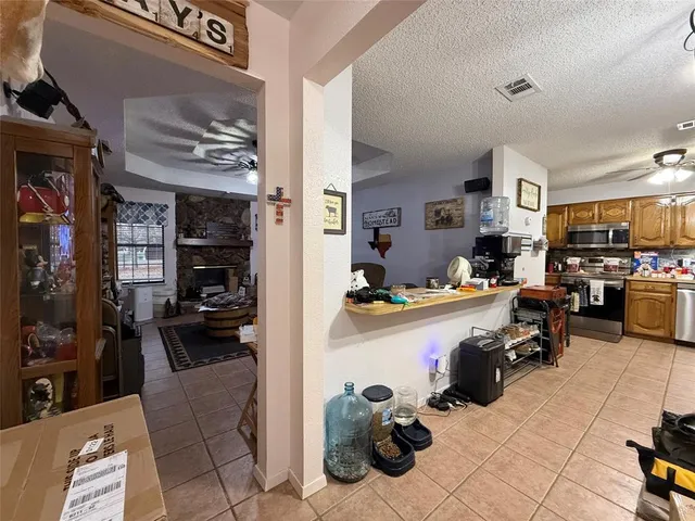 a view of a livingroom with closet and gym equipment
