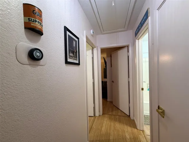 a white toilet sitting next to a bath tub