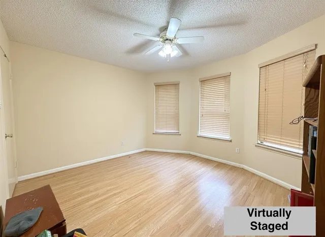 a room with gym equipment and a flat screen tv