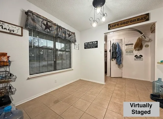 a room with gym equipment and a view of living room
