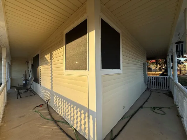 a bathroom with a granite countertop sink a mirror and a shower