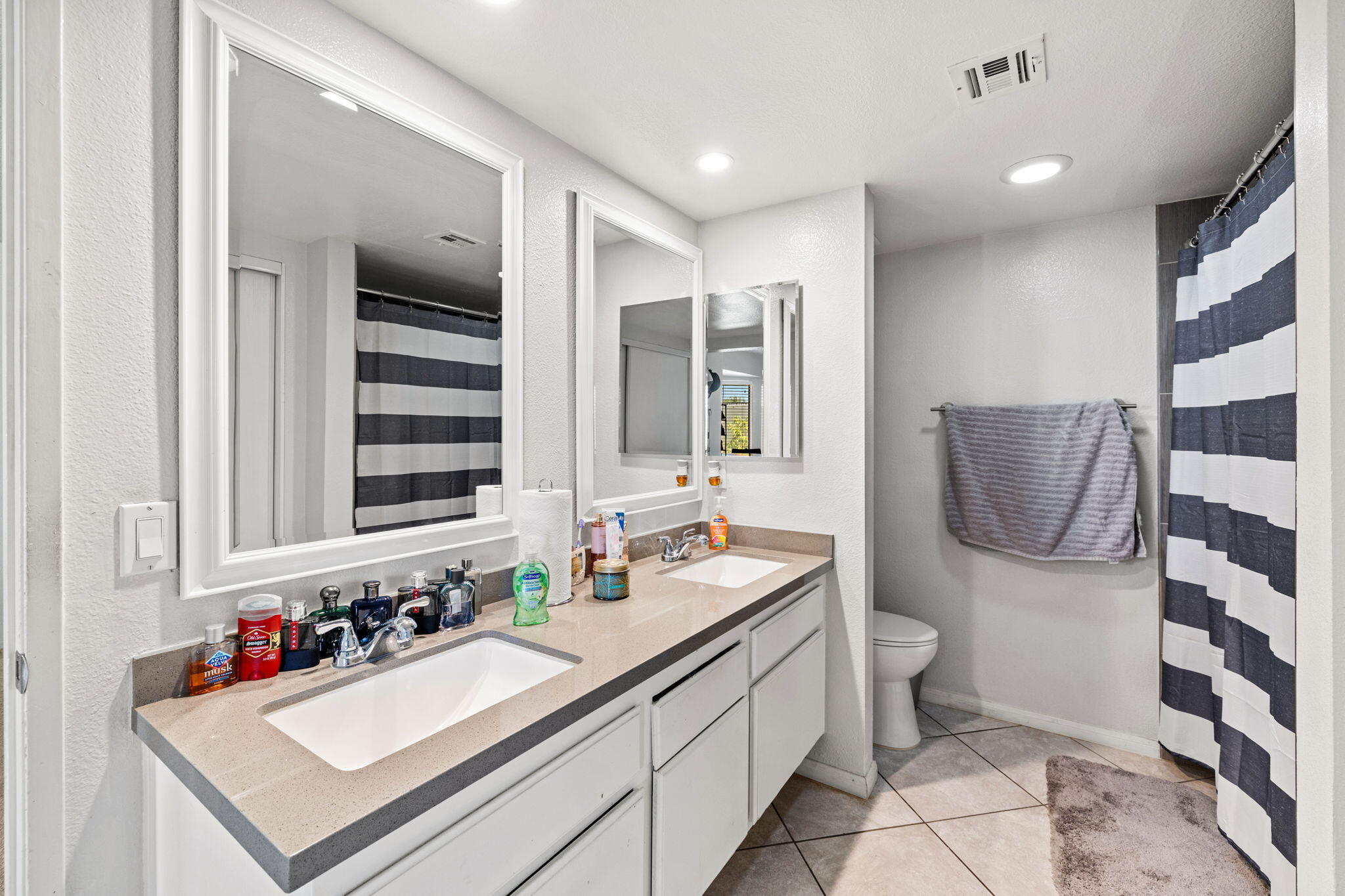 82445 Arlene Drive Indio, CA 92201 - Photo 11 of 18 a bathroom with a sink double vanity and a mirror