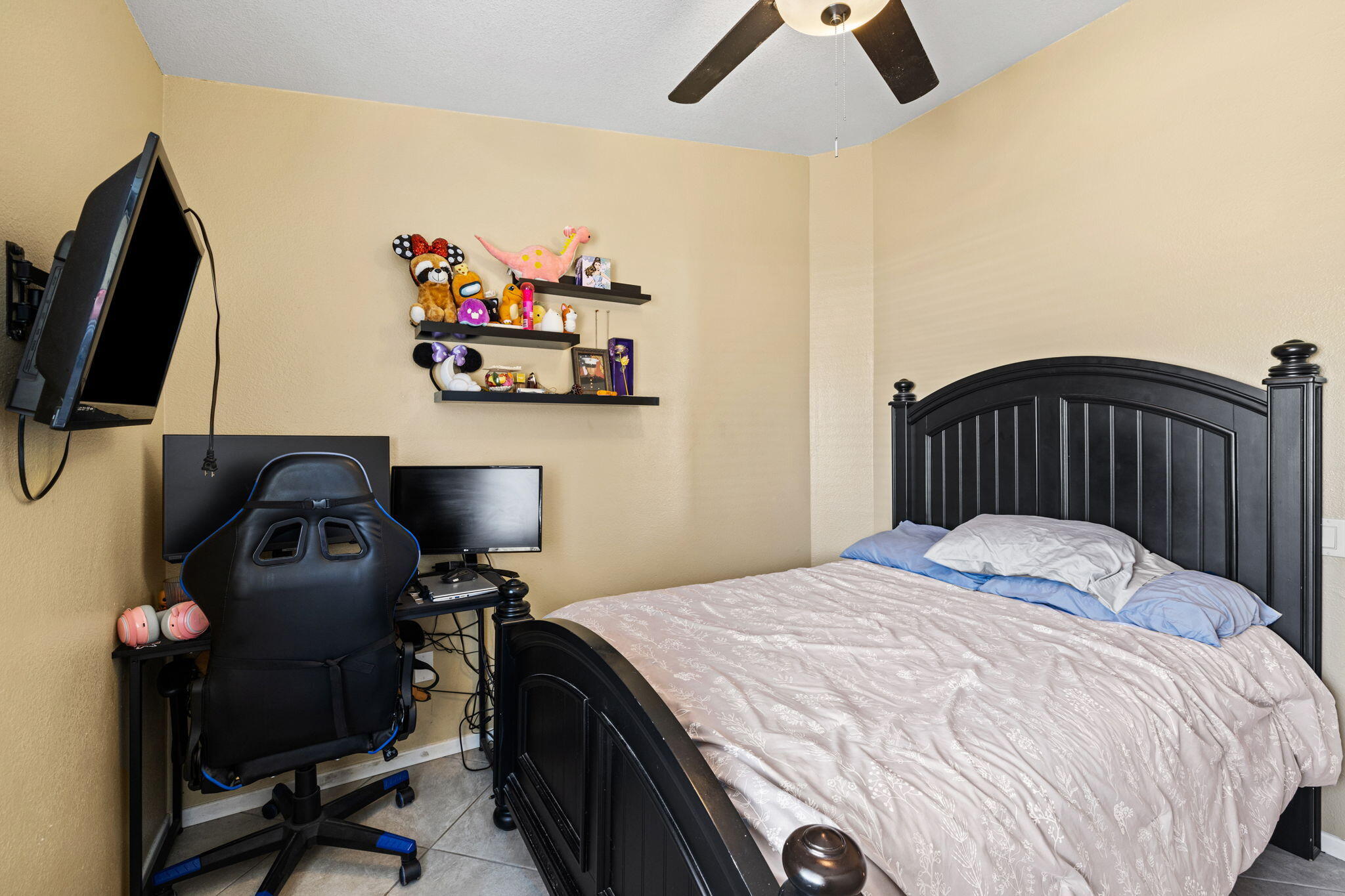 82445 Arlene Drive Indio, CA 92201 - Photo 12 of 18 a bedroom with a bed and a flat screen tv