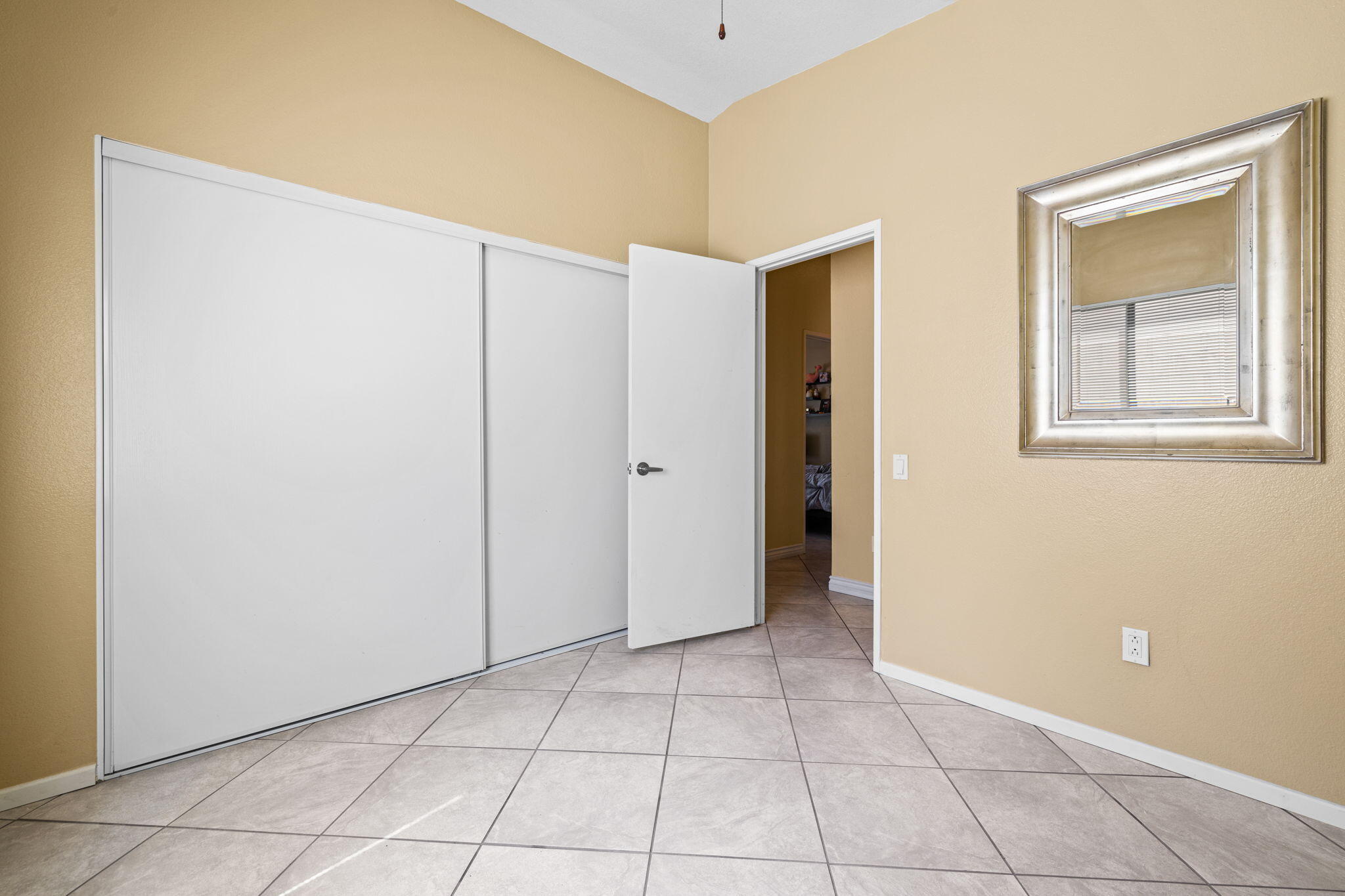 82445 Arlene Drive Indio, CA 92201 - Photo 14 of 18 a view of an empty room with closet and a window